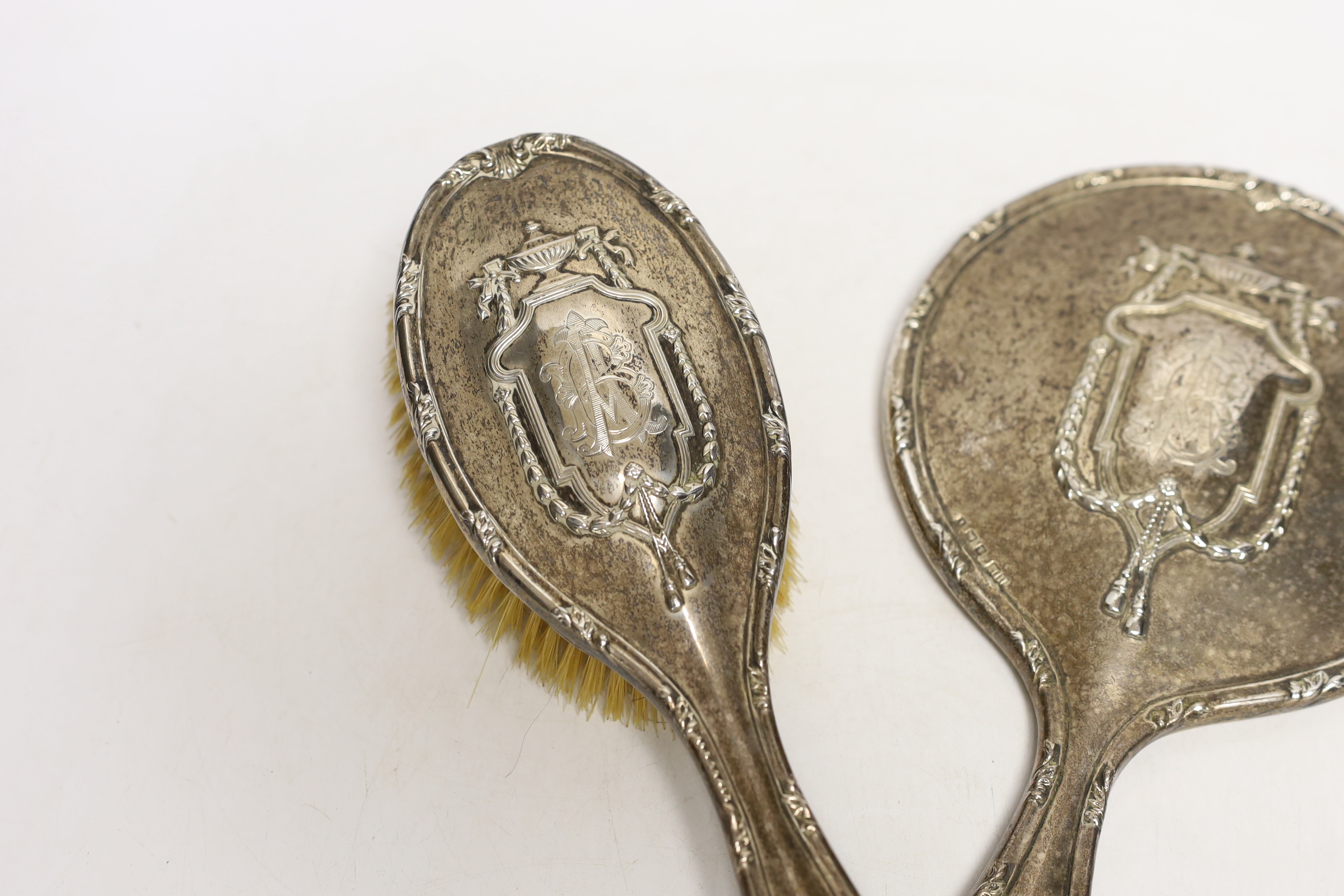 An Edwardian silver mounted hand mirror and hair brush, Henry Matthews, Birmingham, 1908 and a modern 925 pill box modelled as a wrapped sweet.